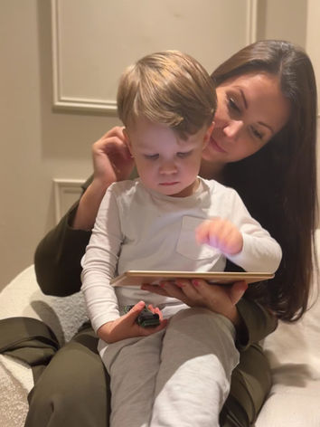 Mother and toddler bonding at bedtime with bedtime app