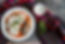 Mexican chilaquiles food with spicy red sauce, chicken and avocado traditional breakfast i
