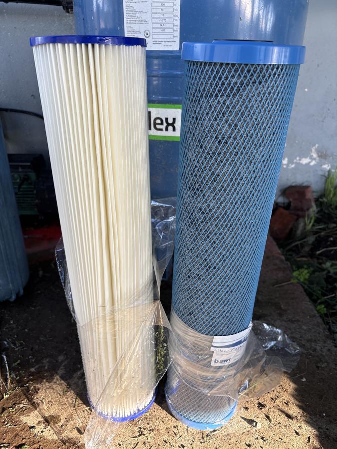 Going in: New sediment and BWT carbon cartridges ready to fit.