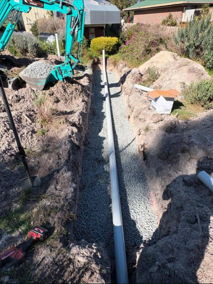 Aggregate bed: Aggregate laid along the trench with the new line.
