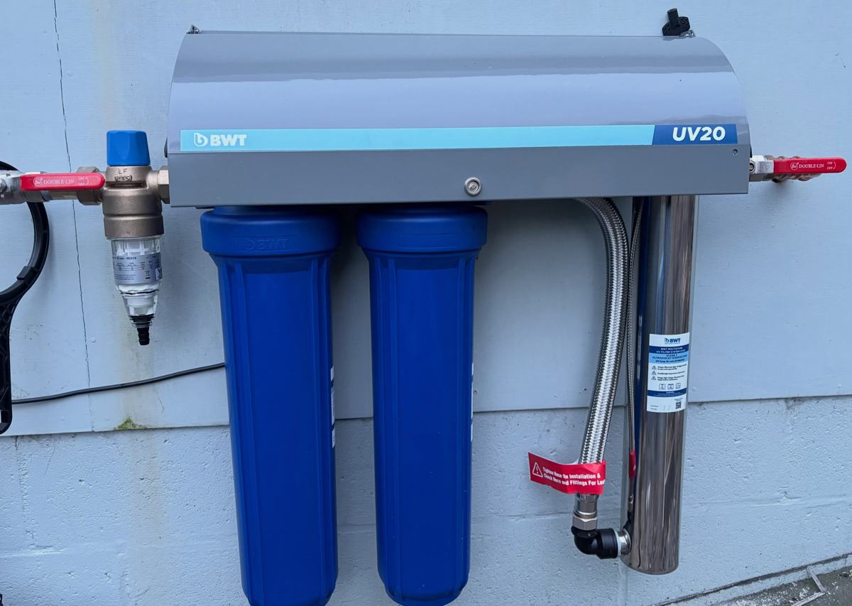 BWT UV20 multistage UV filtration system with twin filter housings, installed on an exterior wall