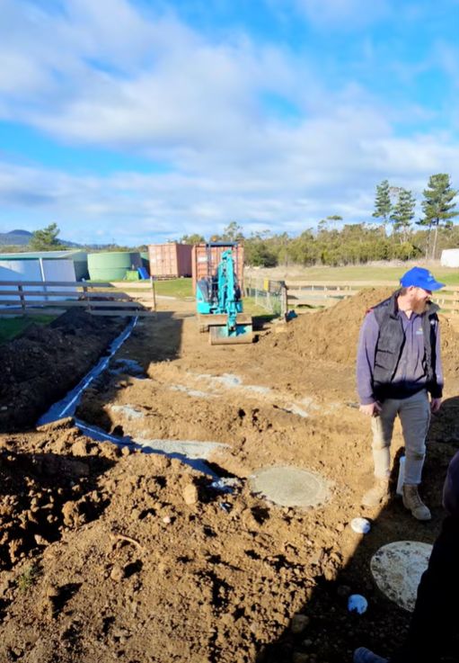 Running the new drain lines across the site