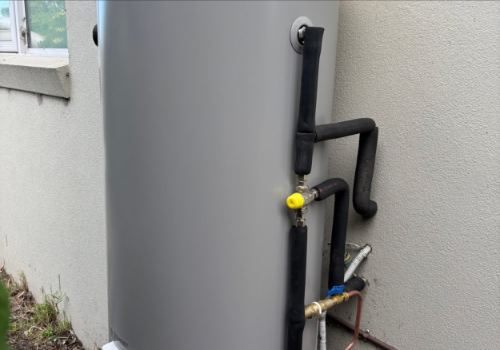 Newly installed hot water storage tank with insulated pipework