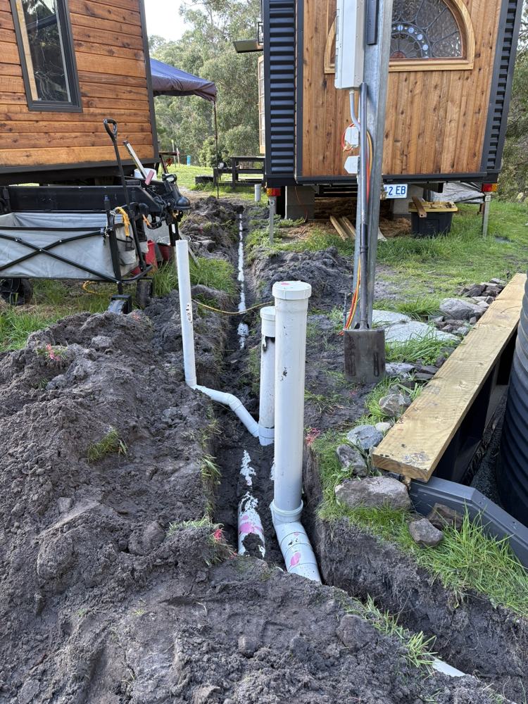 New drainage line with inspection openings laid in a trench