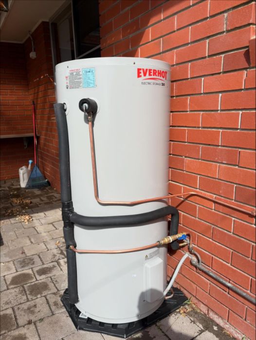 New Everhot hot water system against a brick wall