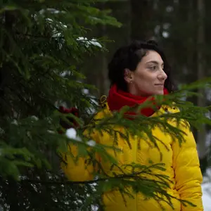 Amazing contrast between the cold and dark forest and the colourful clothes!