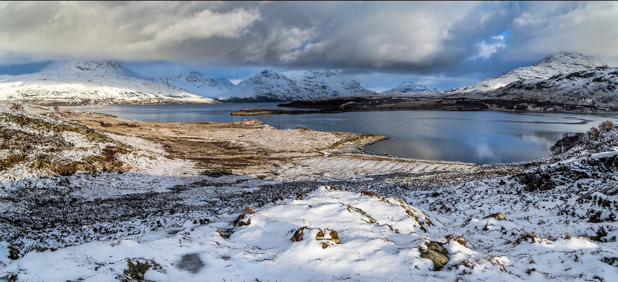 A wintry Torridon with clouds clearing the mountains.