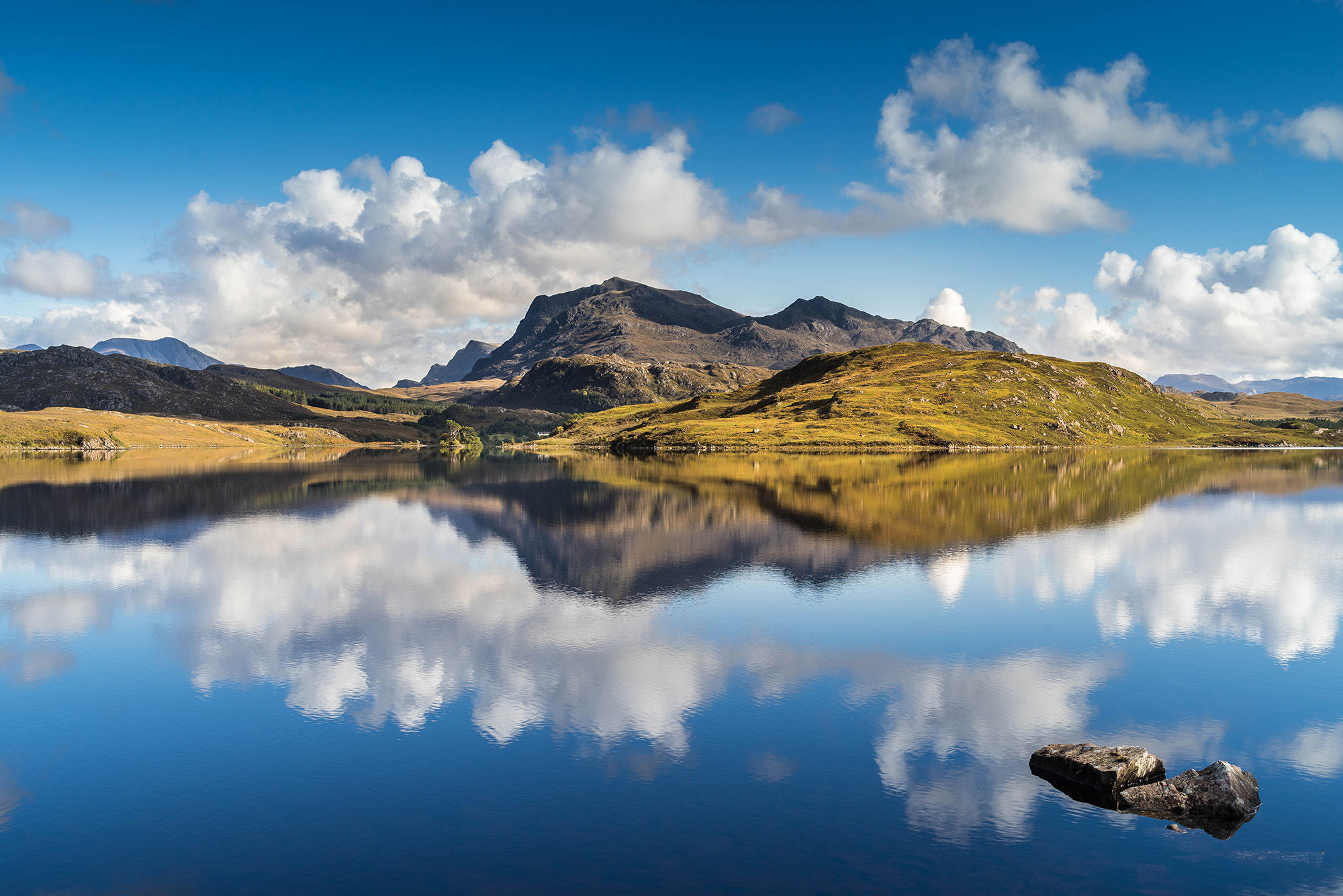 Beinn Airigh Charr reflecting in clam Loch Kernsary.
