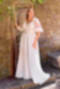 Thumbnail: Front view Envy by Phoenix PH7012 plus-size chiffon A-line wedding dress with lace illusion angel sleeve