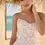 Thumbnail: Close up front Rebecca Ingram Kiandra A-line wedding dress with cat-eye neckline, chic lace bodice and tulle skirt