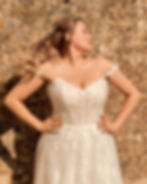 Close up front view of Envy by Phoenix PH8213 plus-size A-line wedding dress with lace illusion bodice
