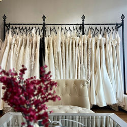 Interior shot of Wedding Belles bridal boutique showing welcome area and wedding dresses
