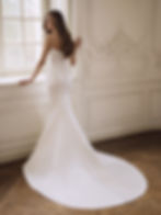 Back view of Etoile Fianna fit and flare wedding dress with embroidered lace bodice, sweetheart neckline and satin skirt