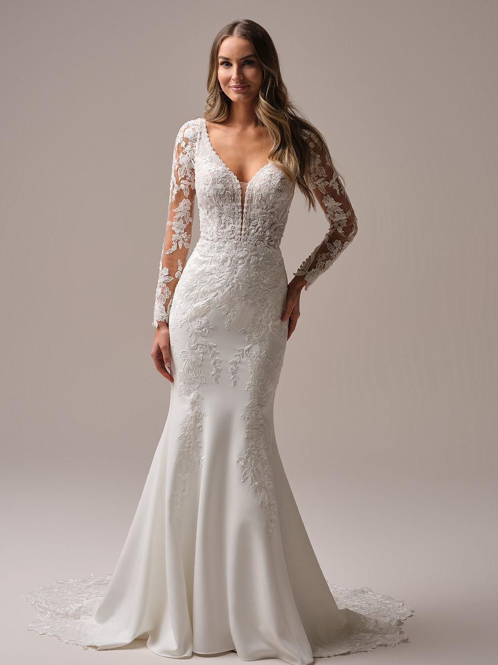 Front view of Rebecca Ingram Larissa Boho deep-V detailed fit-and-flare bridal gown with lace illusion sleeves