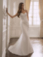 Front view of Etoile Fianna fit and flare wedding dress with embroidered lace bodice, sweetheart neckline and satin skirt