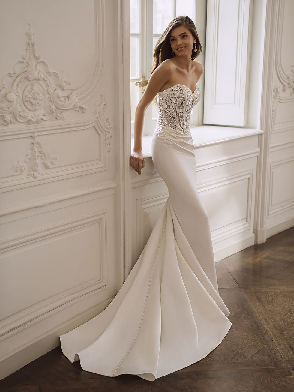 Thumbnail: Side view of Etoile Fianna fit and flare wedding dress with embroidered lace bodice, sweetheart neckline and satin skirt