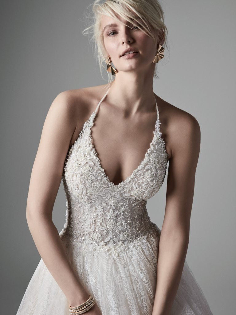 Thumbnail: Close up of front of Sottero and Midgley Thaddeus chantilly lace ballgown with halter V-neckline