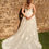 Thumbnail: Back view of Envy by Phoenix PH8213 plus-size A-line wedding dress with lace illusion bodice