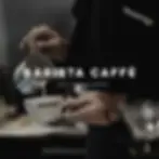 Barista Caffè logo prominently displayed with a barista pouring milk into a branded coffee cup, emphasizing the specialty coffee identity.
