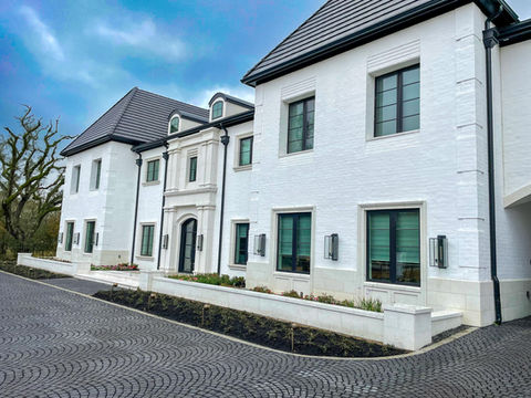 Cast Stone Entry, Windows Sounds, Watertable Band, Panels, Coping and Caps
Cast Stone Texture: Wet Pour
Cast Stone Color: W9
Brick Smear: 1 coat smear with Domingue Mineral Paint over