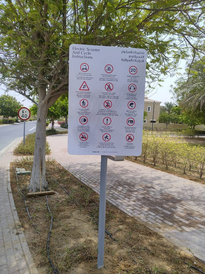 Public park safety information board with prohibition and instruction symbols