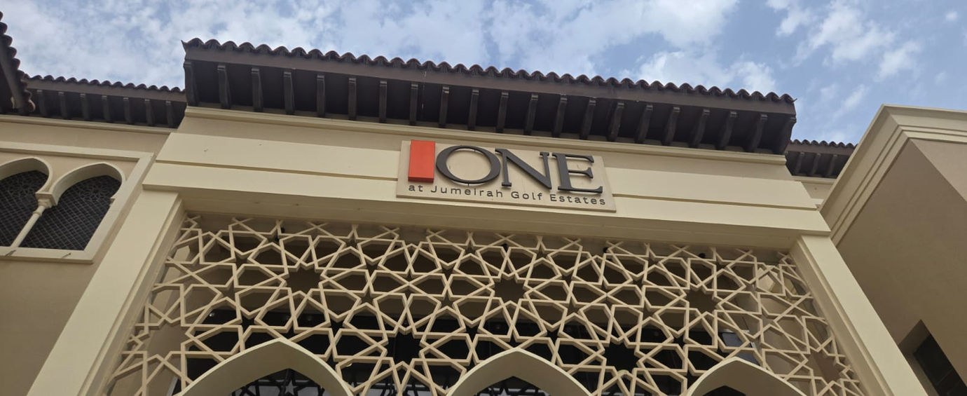 Building facade featuring decorative architectural business logo signage