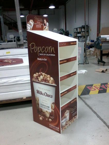 Custom coffee promotional display stand fabricated for retail marketing in Dubai.