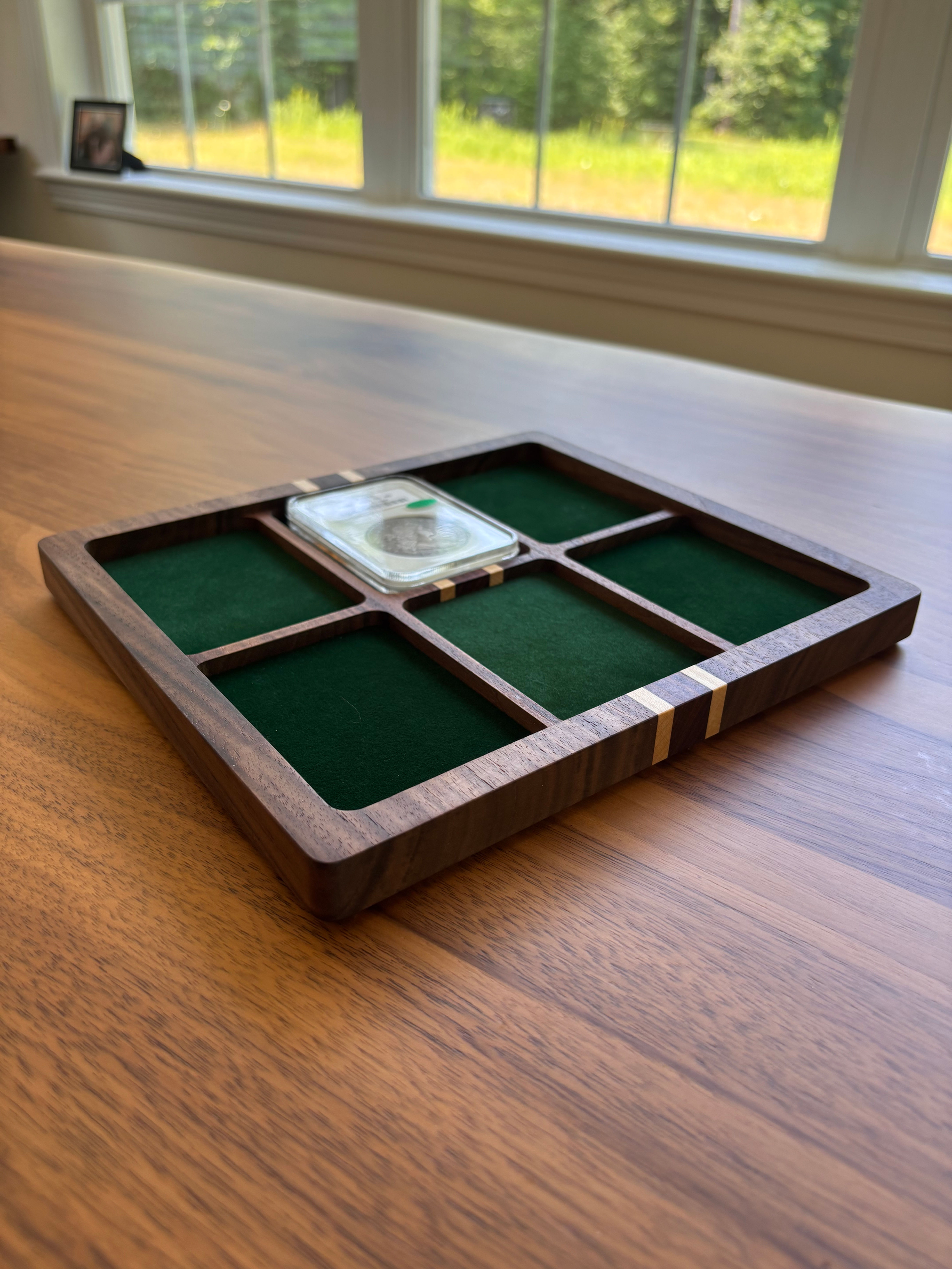 Wood coin tray with 6 slab spaces and green liners, angled view