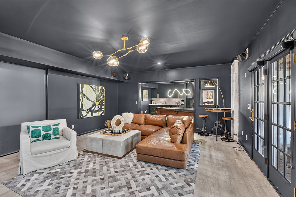 Modern basement lounge area with leather sectional sofa