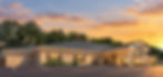 Modern commercial building exterior at sunset with parking