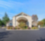 Gainesville Academy building exterior with stone archway
