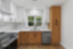 Atlanta real estate photography of a modern kitchen with wood cabinets