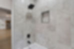 Atlanta real estate photography of a marble tiled shower