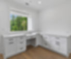 Modern white laundry room with Atlanta real estate photography.