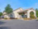 Commercial building with stone accents and arched portico