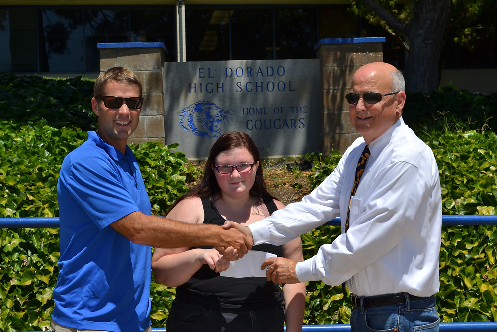 El Dorado High School alumni Joe Harn presents a check to El Dorado High School Vice Prinicipal and Hands4Hope Placerville Steering Committee member Justin Gatlin and incoming Hands4Hope Club leader Camry Schoenahl in support of securing the Hands4Hope Club program on El Dorado's campus.