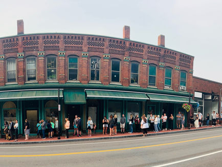 A long line waiting outside LuAnn's Bakery & Cafe in Stafford, CT.
