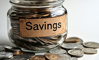 vecteezy_saving-coins-in-a-glass-jar-labeled-for-financial-goals-at_55229342.jpeg