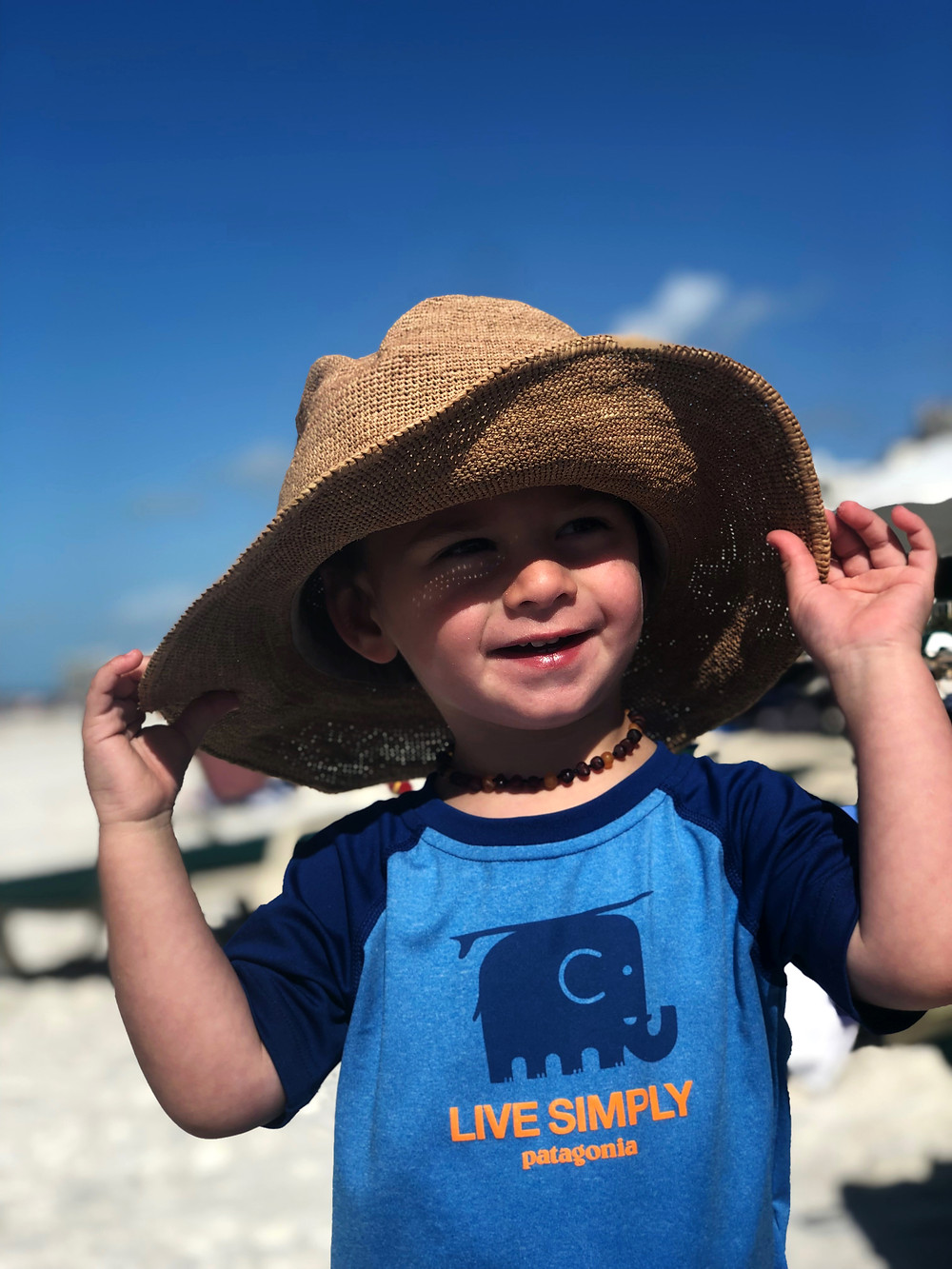 toddler boy wearing beach hat