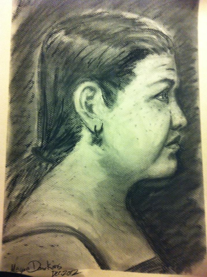 charcoal profile drawing of woman with hair tied back