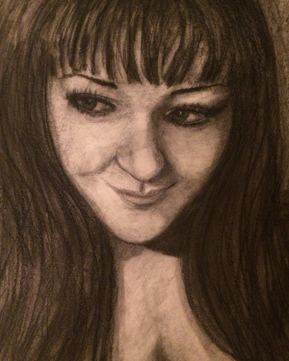 charcoal self portrait of woman looking to the side