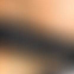 Sign with white text on black reads "To the glorious and unknown" against a blurred brick background, evoking mystery and adventure.