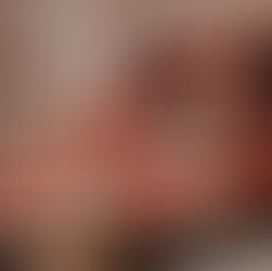 Someone grabbing a piece of pizza