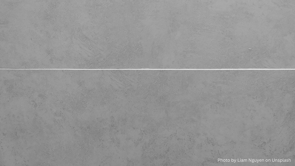 A horizontal white line crosses a textured gray concrete wall, creating a minimalistic and serene abstract composition.