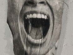 Black and white poster of a wide open mouth on a textured gray wall, conveying a sense of shouting or raw emotion.