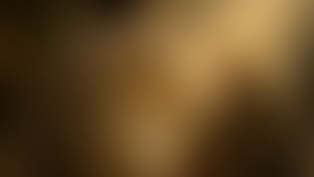 Robed figure gently touches a seated blindfolded person in warm golden light, evoking a calm healing scene.