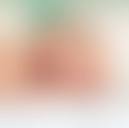 picture of baby laying on their side smiling