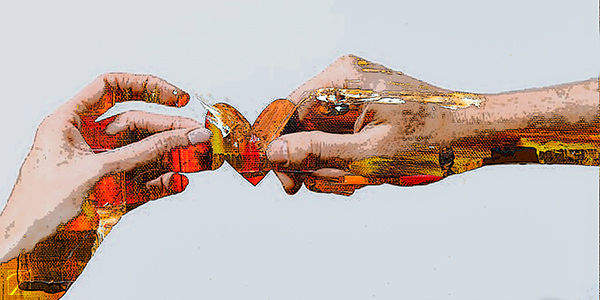 abstract photo of two hands passing a heart to the other