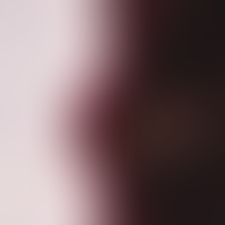 Pregnant woman in a burgundy dress holding her belly, standing against a sheer, light curtain. Light creates a peaceful, intimate mood.