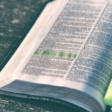 open Bible with highlighter and highlighted verses.